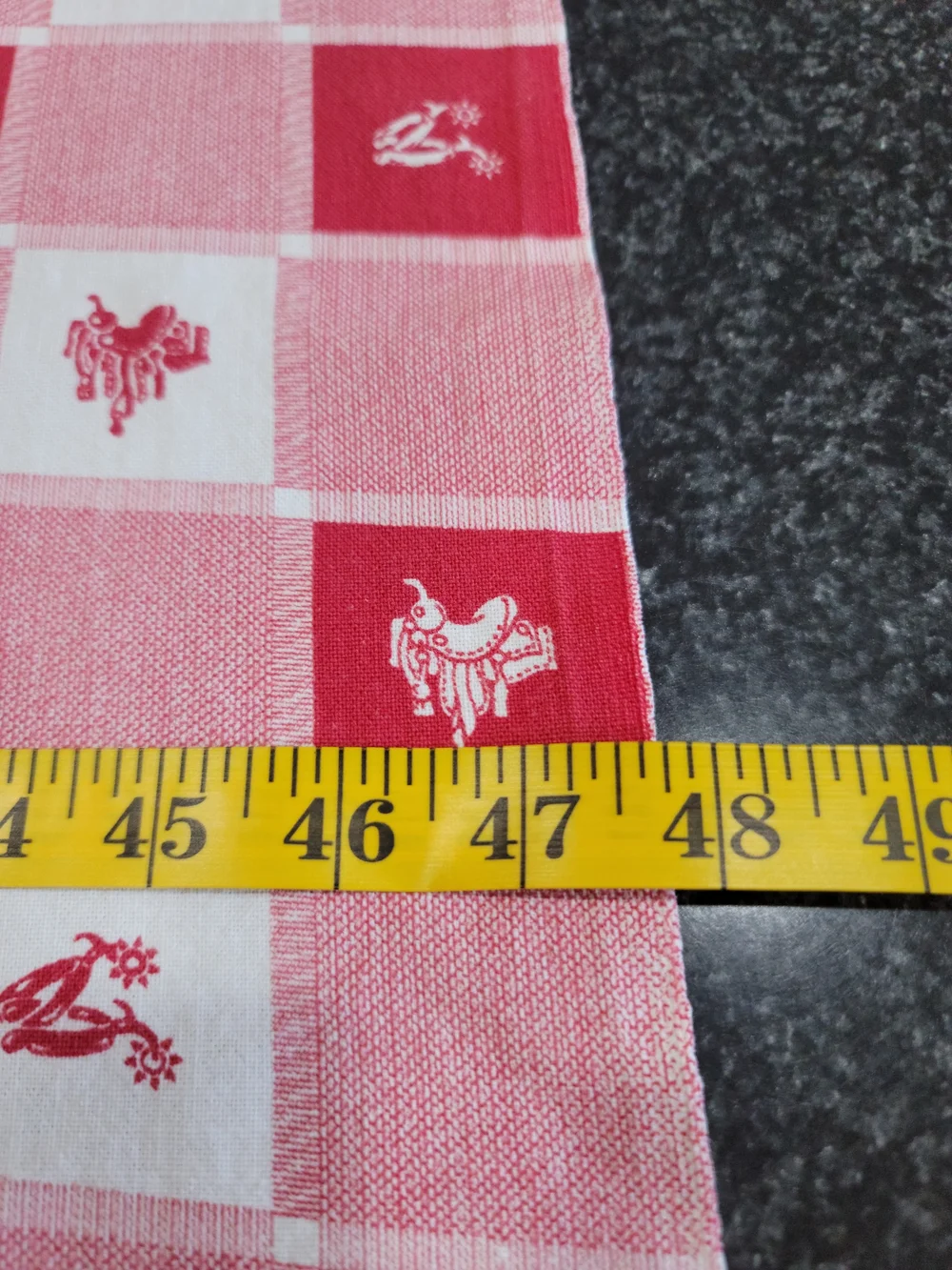 Vintage red and white checkered tablecloth small western-style horse saddle